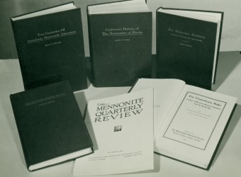 Image caption: 20th century image of the Oct 1944 issue of Mennonite Quarterly Review and the first five publications in the Studies in Anabaptist and Mennonite History book series, these published between 1929 and 1941. (Image provided by the Mennonite Historical Library.)